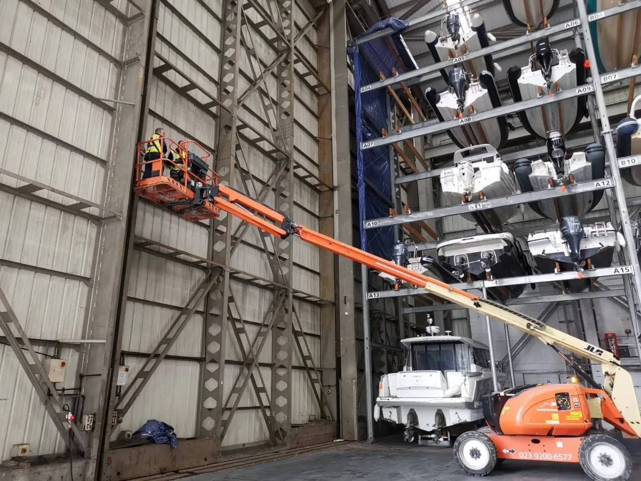 Cherry picker extended inside the DRYSTACK boat storage during the install